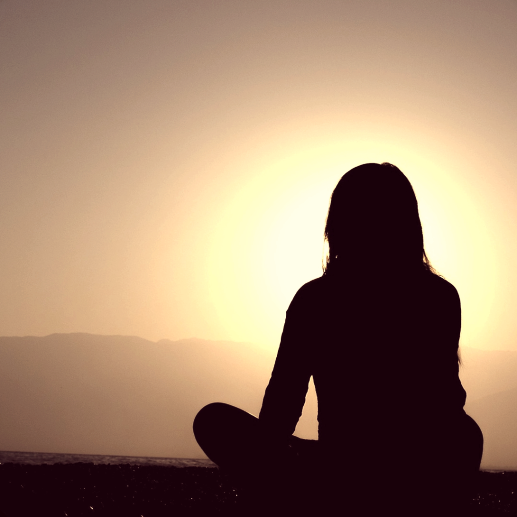 Woman meditating ….used for the blog post entitled: Success Tips: 8 Really Destructive Words You Need To Stop Using if You Truly Want to Succeed.