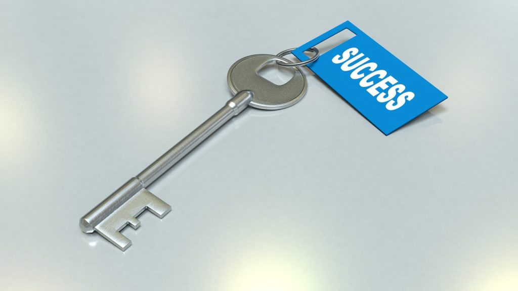 Image of a silver key …used for the blog post entitled: “ONLINE SUCCESS: How to properly set goals so you actually reach them.”