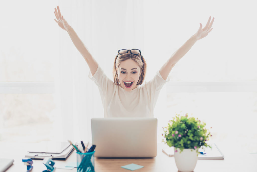 Excited woman behind her laptop ….used for the blog post entitled: “Network Marketing Downline: What to do When Nobody’s Doing Anything!”